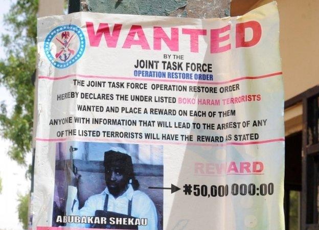 A poster displayed in Maiduguri, Nigeria, shows the photograph of Abubakar Shekau, leader of the militant Islamist group Boko Haram, declared wanted by the Nigerian military with a reward for information that could lead to his capture -1 May 2013