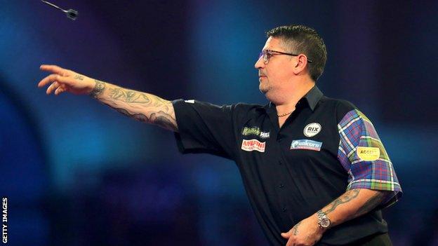 Gary Anderson in action at the Alexandra Palace