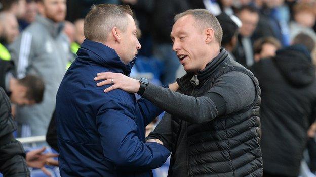 Neil Harris and Steve Cooper shake hands after the South Wales Derby