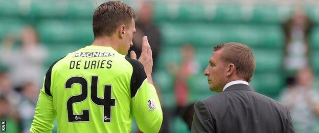 Celtic's Dorus de Vries and Brendan Rodgers chat after the game