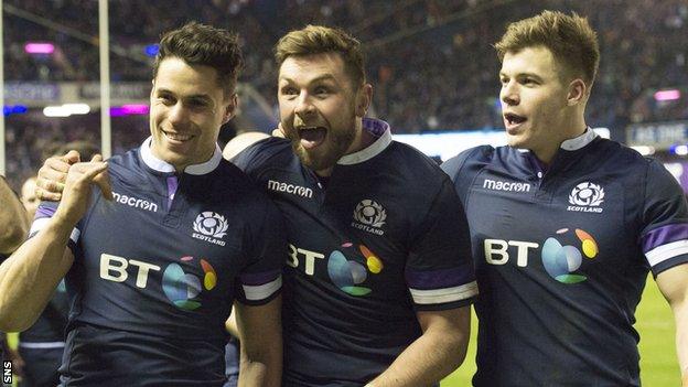 Sean Maitland, Ryan Wilson and Huw Jones celebrate Scotland's Calcutta Cup win over England