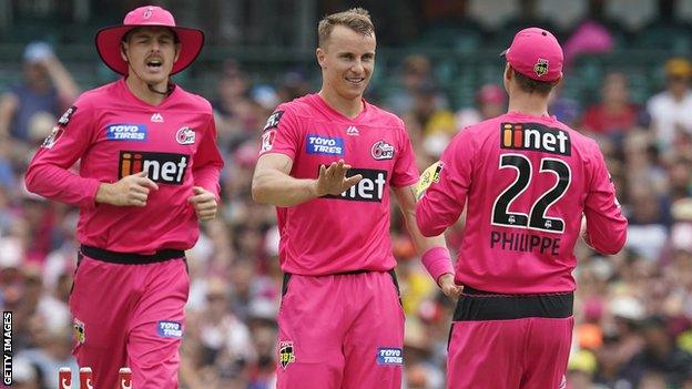 Tom Curran celebrates taking a wicket for Sydney Sixers in the Australian Big Bash League