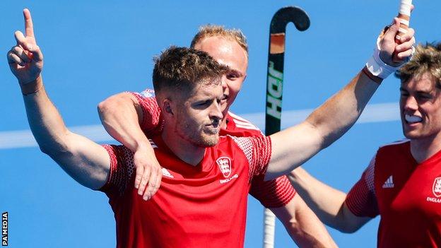 Nick Bandurak celebrates scoring against France