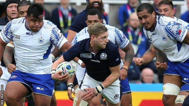 The Samoa defence looks to hunt down Scotland fly-half Finn Russell