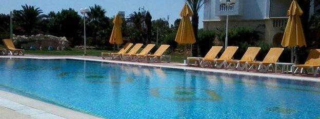 Undated handout photo issued by Heidi Barlow of empty deck chairs around a pool at Hotel Belisaire in Hammamet, Tunisia