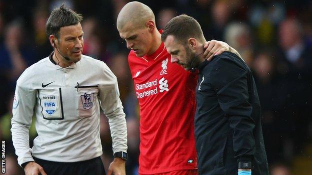 Martin Skrtel is helped off the pitch