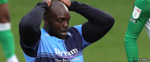 Adebayo Akinfenwa looks dejected