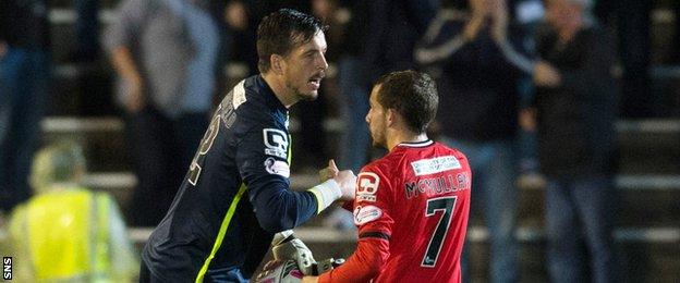 Jamie Langfield shakes hands with team-mate Paul McMullan