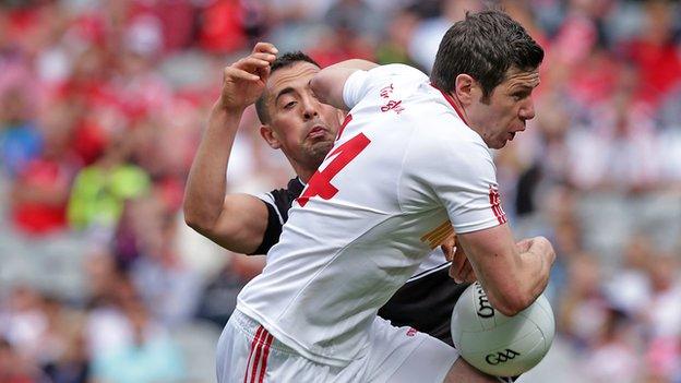 Sligo's Neil Ewing battles with Tyrone's Sean Cavanagh at Croke Park