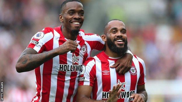 Bryan Mbeumo of Brentford celebrates his goal, alongside teammate Ivan Toney, in the 5-2 home win over Leeds United in September 02022.