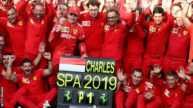 Charles Leclerc celebrates with his Ferrari team