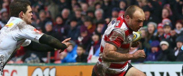 Steve McColl (right) goes in for Gloucester