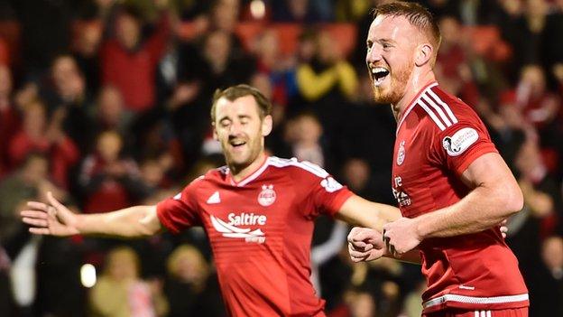 Adam Rooney (right) scored Aberdeen's opener from the penalty spot