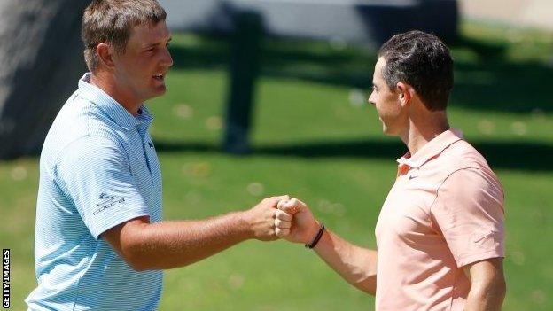 Bryson DeChambeau and Rory McIlroy on the 18th green at Colonial Country Club