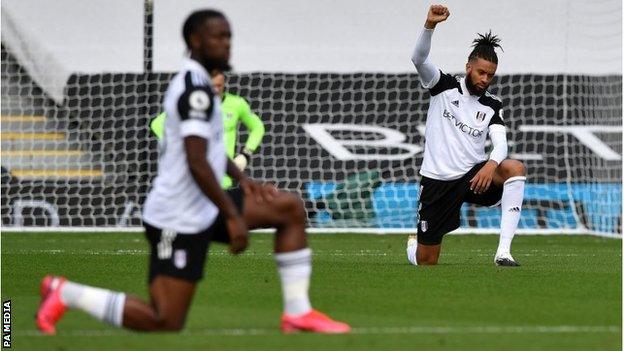 Michael Hector takes a knee