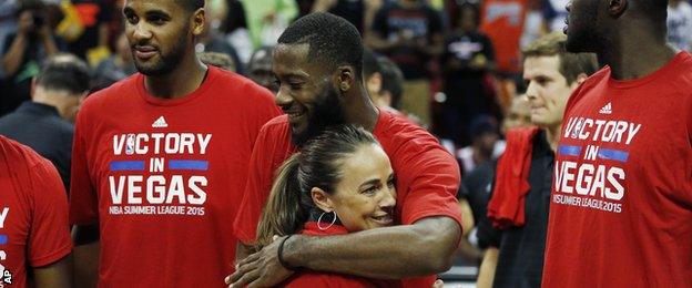 San Antonio Spurs coach Becky Hammon hugs Jonathan Simmons