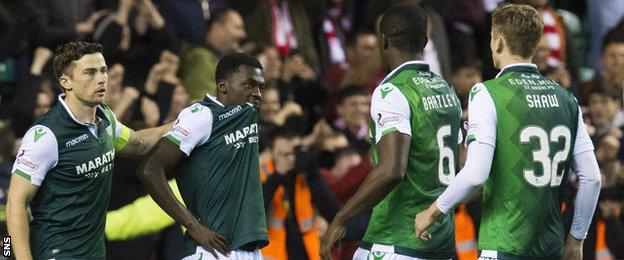 Hibernian's Thomas Agyepong (centre) is consoled by his teammates after missing the last penalty.