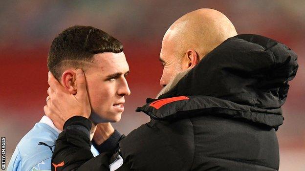 Manchester City boss Pep Guardiola and forward Phil Foden