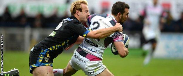 Tom Habberfield scores for the Ospreys despite Nick Abendanon's tackle