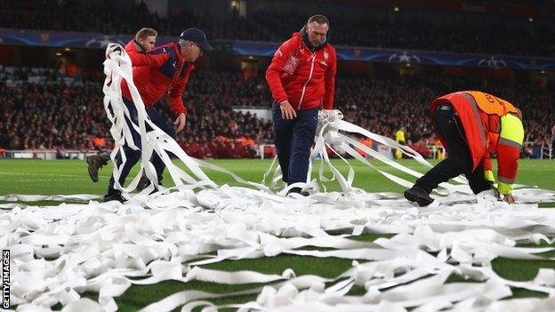 Stewards clean up toilet paper