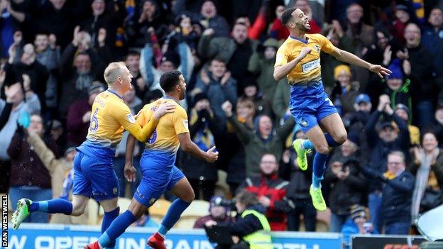 CJ Hamilton celebrates putting Mansfield 2-0 up against Notts County