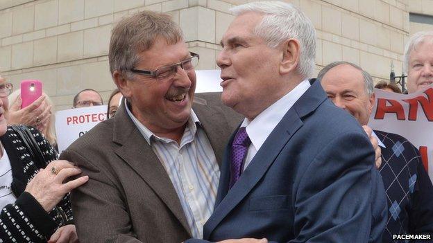 Pastor James McConnell with DUP MP Sammy Wilson outside court