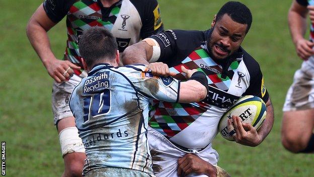 Harlequins' Darryl Marfo is tackled by Ceri Sweeney of Cardiff