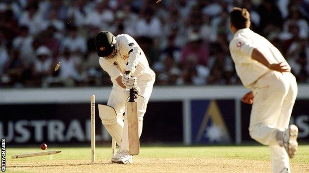 Stuart MacGill is bowled by Darren Gough