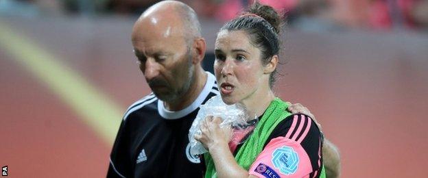 Scotland striker Jane Ross leaves the field injured against England