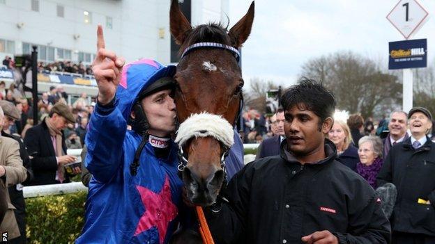 Paddy Brennan celebrates victory on Cue Card