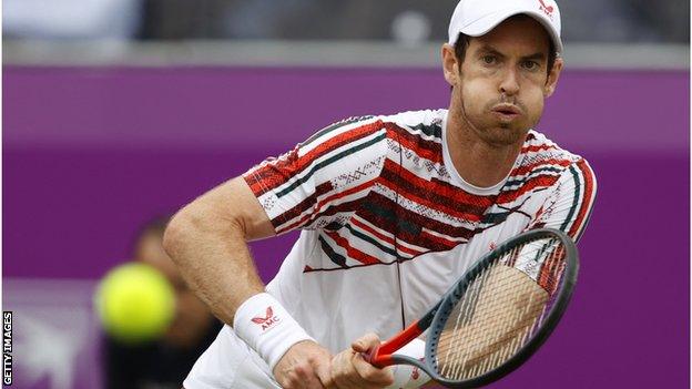 Andy Murray returns a ball at Queen's