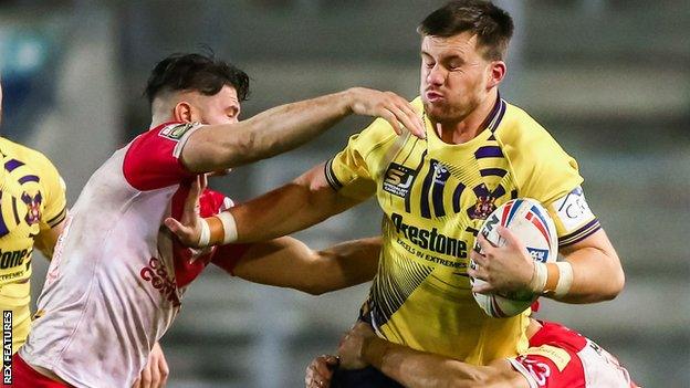 Wigan second row Joe Greenwood in action against St Helen's