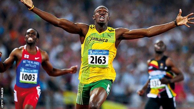 Usain Bolt celebrates gold at the Beijing Olympics