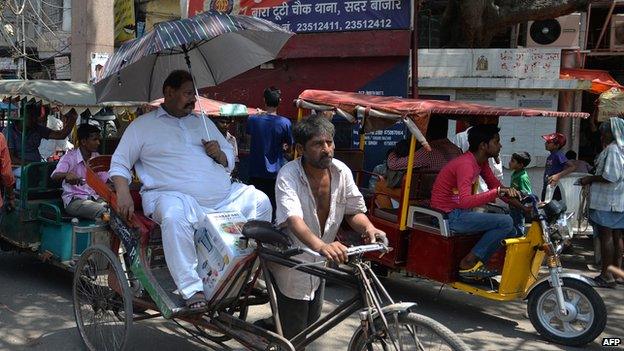 Indian man in rickshaw