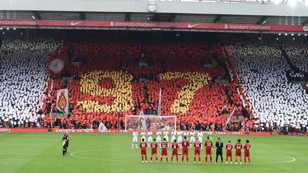 Liverpool fans hold up a 97 mosaic in memory of supporter Andrew Devine