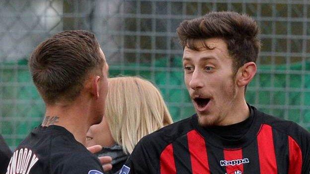 Jordan Forsythe celebrates with Matthew Snoddy after scoring the second Crusaders goal at Warrenpoint