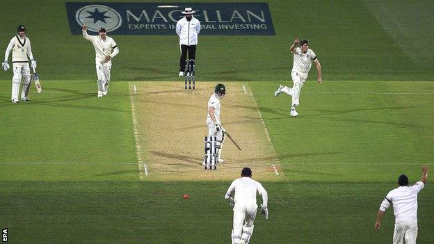 Craig Overton celebrates his first Test wicket