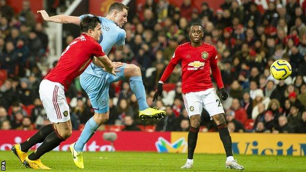 Burnley's Chris Wood volleys past Manchester United's David de Gea