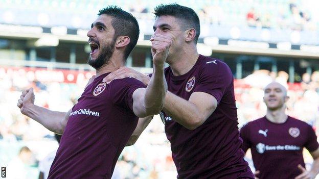 Hearts' Igor Rossi (left) celebrates after scoring his side's fourth goal