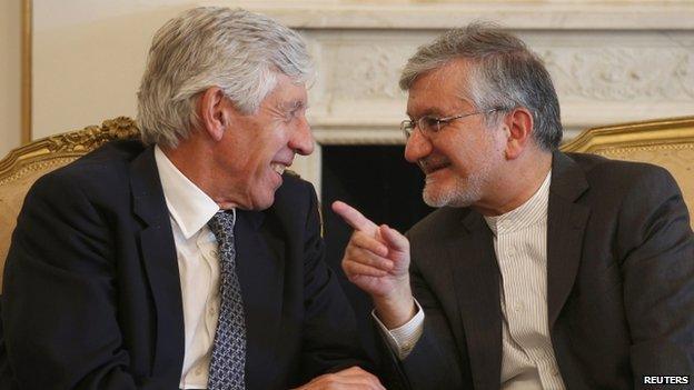 Iran's Deputy Foreign Minister, Mehdi Danesh Yazdi (R) speaks with former British Foreign Secretary Jack Straw