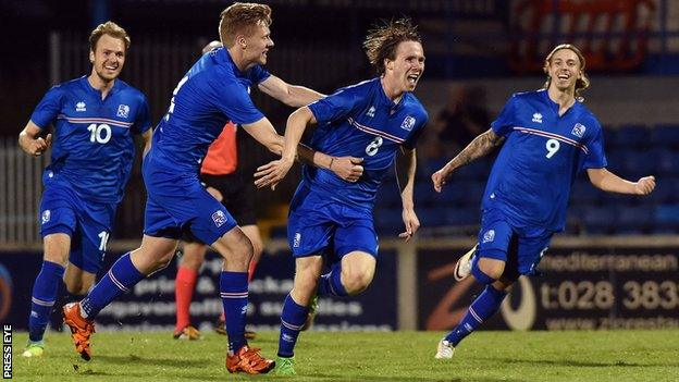 Heidar Aegisson is congratulated after scoring a late winner at Mourneview Park