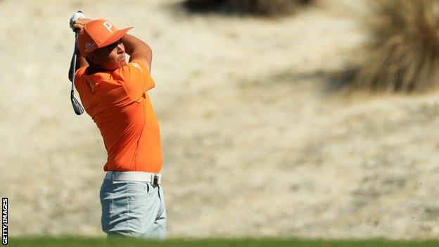 Rickie Fowler plays a shot at the Hero World Challenge