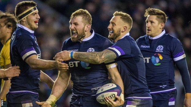 Scotland players celebrate John Barclay's try against Australia