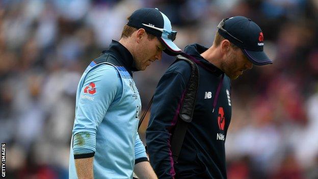 England captain Eoin Morgan walks off the field with a back injury against West Indies