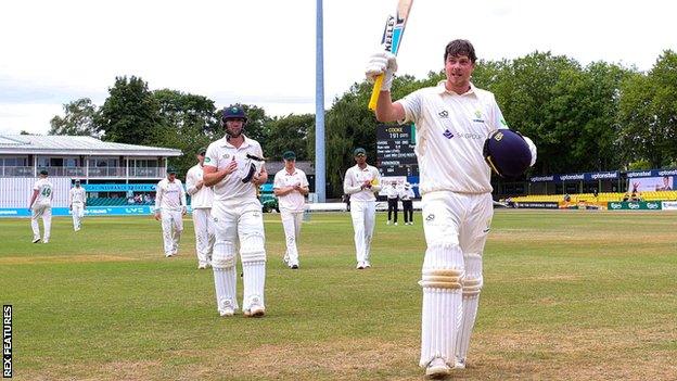 Sam Northeast (R) and Chris Cooke walk off at Leicestershire after setting a Glamorgan record partnership of 461