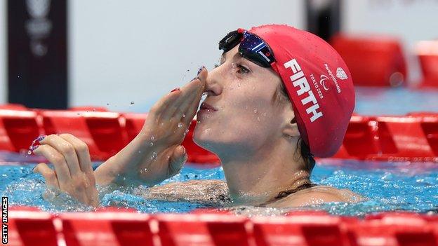 Bethany Firth blows a kiss after winning gold in the S14 100m backstroke