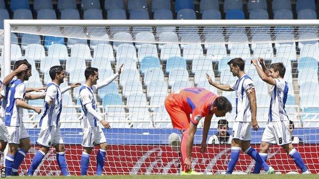 Real Sociedad celebrate scoring against Granada