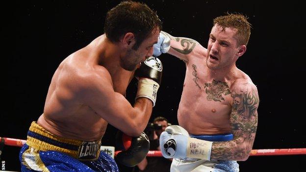 Ricky Burns throws a right at Italy's Michele Di Rocco