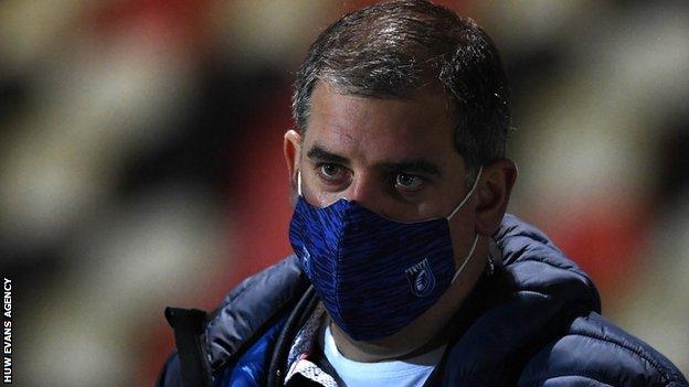 Richard Holland wears a mask at a Cardiff Blues game