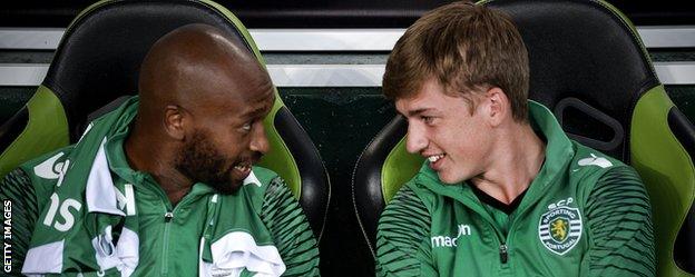 Mahmoud Shikabala and Ryan Gauld on the Sporting Lisbon bench